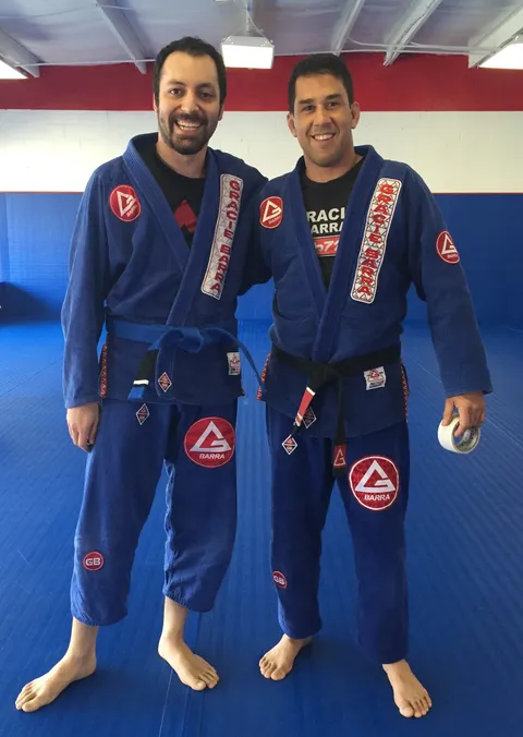 Kenan with his first Brazilian jiu-jitsu instructor, Professor Corvo